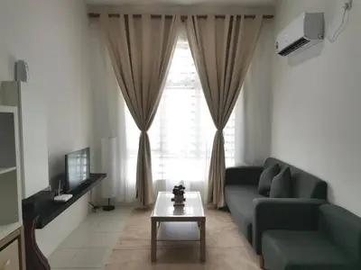 a living room with a couch and a coffee table at myuu homestay in Ipoh