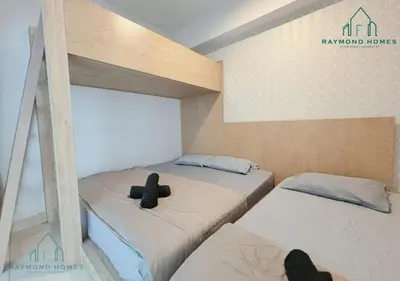 two beds in a small room with two at Maritime Sea View Duplex in George Town