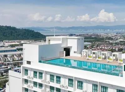 a building with a swimming pool on top of it at NEW-Serene Home Juru Sentral Icon City in Bukit Mertajam