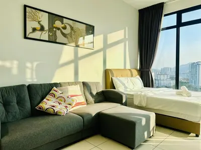 a living room with a couch and a bed at 2BR Georgetown Luxury Suite #RooftopPool #Beacon in George Town
