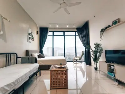 a hotel room with two beds and a television at 8Pax City Centre 2BR 3km to Komtar in George Town
