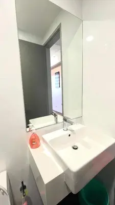 a white bathroom with a sink and a mirror at 8Pax City Centre 2BR 3km to Komtar in George Town