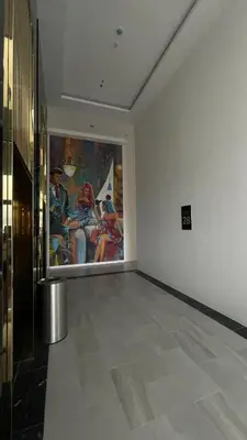 a room with a large painting on the wall at 8Pax City Centre 2BR 3km to Komtar in George Town