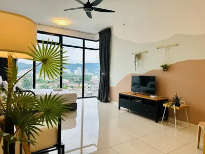 a bedroom with a tv and a large window at Comfy 2BR Sunny Suite Sky Pool & Stunning Views in George Town