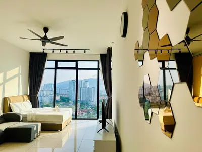 a living room with a bed and a large window at Elegant 2BR Luxury Suite in Haaven in George Town