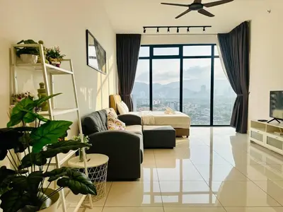 a living room with a couch and a bed at Elegant 2BR Luxury Suite in Haaven in George Town
