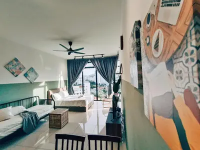 a living room with two beds and a ceiling fan at Haven Luxury 2BR Suite with Stunning Views in George Town