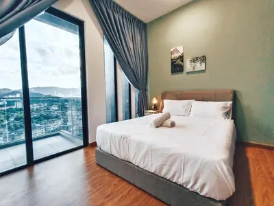 a bedroom with a large bed with a large window at Haven Luxury 2BR Suite with Stunning Views in George Town