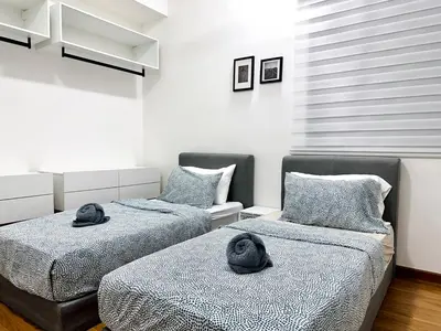 two beds with hats on them in a room at Luxury 2BR SunnySuite Sky Pool Breathtaking Views in George Town