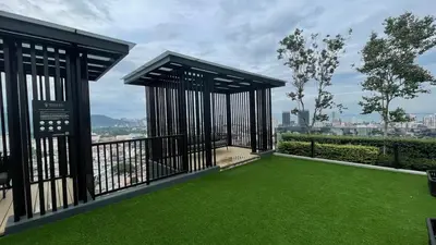 a balcony with green grass and a view of a city at Luxury Sky Pool 8-Pax City Centre Beacon in George Town