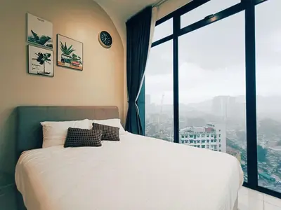 a bedroom with a white bed and a large window at Stunning 2BR with Infinity Pool & City Views in George Town