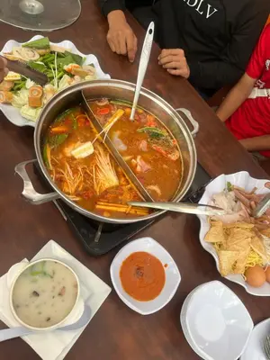 a large pot of soup sitting on a table at Muhammad Najmi Hakim Bin Abdullah in Kampar