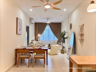 a living room with a dining table and a ceiling fan at Falim Residence Condo Ipoh with 2 Parking in Ipoh