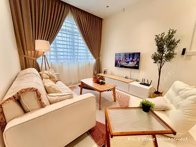 a living room with a couch and a tv at Falim Residence Condo Ipoh with 2 Parking in Ipoh
