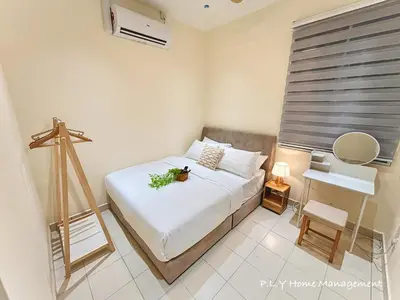 a small bedroom with a bed and a tripod at Falim Residence Condo Ipoh with 2 Parking in Ipoh