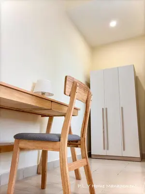 a wooden chair sitting at a desk in a kitchen at Falim Residence Condo Ipoh with 2 Parking in Ipoh