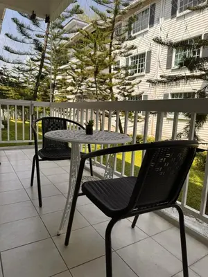 a patio with a table and chairs on a balcony at The Trails Of Kampar in Kampar