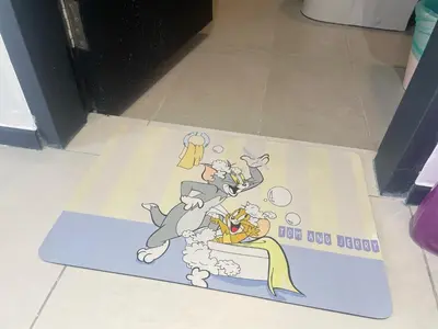 a cartoon rug on the floor of a bathroom at Tom and Jerry Suite with Infinity Pool in George Town