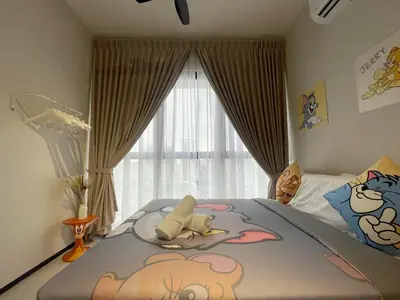 a bedroom with a bed with a large window at Tom and Jerry Suite with Infinity Pool in George Town