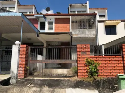 a house with a gate in front of it at Rumah Teres Teluk Kumbar in Bayan Lepas