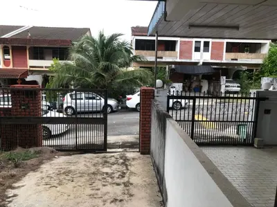 a wrought iron fence in front of a house at Rumah Teres Teluk Kumbar in Bayan Lepas
