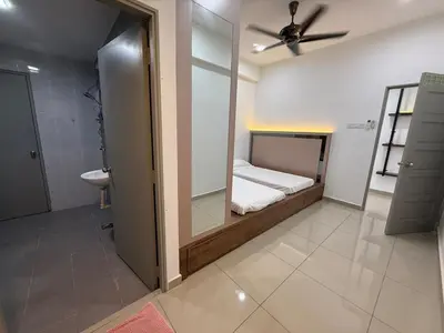 a bedroom with a bed with a mirror and a sink at Venus Home 3Room Pool,PlayGround,Free Wifi,6Pax in Seri Manjung