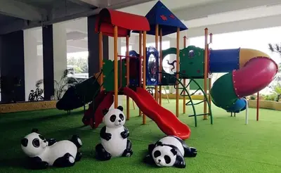 a group of pandas sitting on the ground in a playground at Venus Home 3Room Pool,PlayGround,Free Wifi,6Pax in Seri Manjung