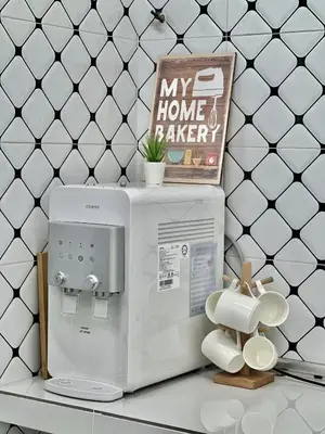 a microwave on a counter with a sign on top at Urban Eats Stay in Ipoh
