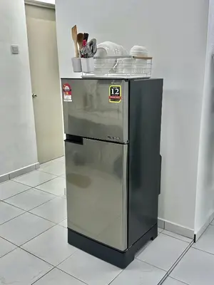 a stainless steel refrigerator in a kitchen at Urban Eats Stay in Ipoh