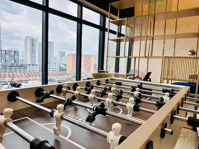 a row of tables in a room with windows at World Class Apartment In Georgetown 3BR 10pax in Jelutong