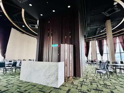 a room with chairs and a table in a building at World Class Apartment In Georgetown 3BR 10pax in Jelutong