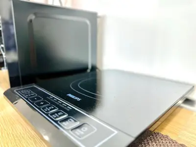 a laptop computer sitting on top of a table at Spacious 3BR Infinity Pool 10pax,Groups & Families 10pax in George Town