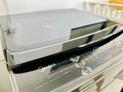 a close up of a toaster oven on a shelf at Familystay Home 3BR-10PAX Urban suites in George Town