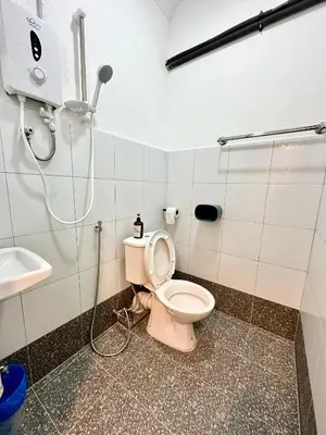 a bathroom with a toilet and a shower at Bahari 58 in George Town