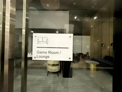 a sign that says game room and lounge on a window at Classic House in Georgetown 3BR 10pax in George Town