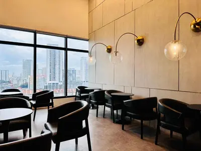 a restaurant with tables and chairs and a large window at Classic House in Georgetown 3BR 10pax in George Town