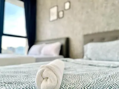 a towel laying on a bed in a bedroom at Classic House in Georgetown 3BR 10pax in George Town