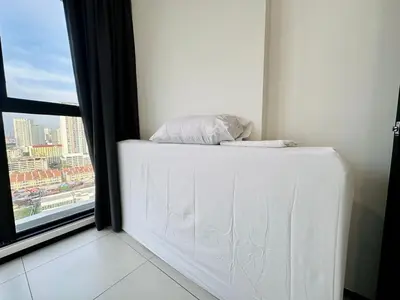 a white mattress in a room with a window at Charming Haven- Relaxing Retreat Nearby Airpor 10pax in George Town