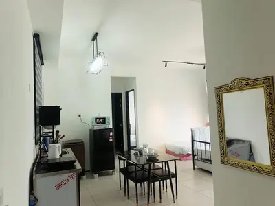 a living room with a table and a mirror at Georgetown Komtar Familystay 3BR 10Pax in George Town