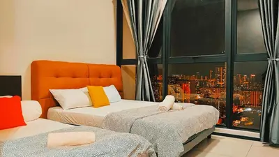 a bedroom with two beds with a view of a city at Georgetown Komtar Familystay 3BR 10Pax in George Town
