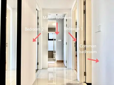a corridor in a house with arrows pointing into a room at Tropicana 218 Macalister #Charm #InfinityPool #WideSeaview #6pax #3BR2bath #1King2Queen #Quality well maintained #Private host in George Town