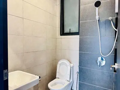 a bathroom with a toilet and a sink and a shower at Skycity & Sea View Penang 3BR 10Pax in George Town