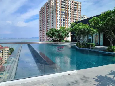 a swimming pool in the middle of a building at Skycity & Sea View Penang 3BR 10Pax in George Town