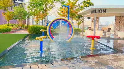 a water park with a pool with a water wheel at Sea View Condo In Georgetown 10 pax in George Town
