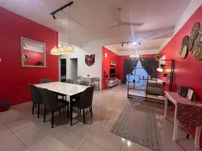 a dining room with red walls and a table and chairs at RedHouse Sky Garden Klabang 10 pax in Chemor
