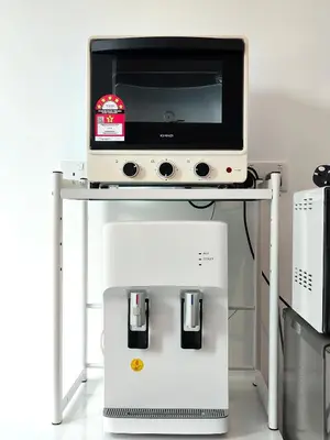 a computer on a stand with a tv on top at TheFloral Penthouse Night Market Wifi & Netflix in Brinchang