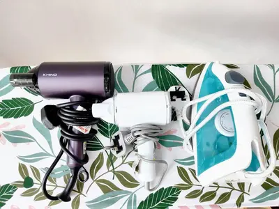 a blow dryer and a camera on a wall at TheFloral Penthouse Night Market Wifi & Netflix in Brinchang