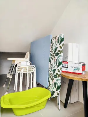 a room with a green tub next to a table at TheFloral Penthouse Night Market Wifi & Netflix in Brinchang