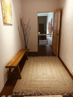 a hallway with a wooden bench and a door at Senju Georgetown Heritage PrewarHouse 4BR 5-15 pax in George Town