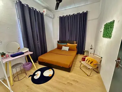 a bedroom with a bed and a chair in it at Cozy95#6pax#Netflix#SukunBukitMertajam in Bukit Mertajam